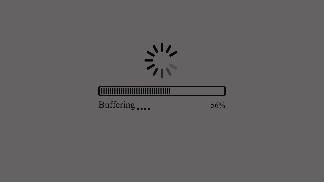 A gray silhouette showing a buffering animation with a progress bar and text. The buffering is a spinning wheel made of short lines, positioned above a horizontal progress bar with the text "Buffering...." on the left and "56%" on the right. The background is a solid dark gray color.
